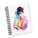 Notebook with a colorful portrait illustration on a white background