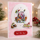 A handmade Christmas card featuring a 3D snowman and deer craft design, set against a festive holiday background with blurred lights and greenery.
