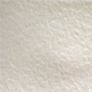 A close-up texture shot of a warm off-white or cream-colored fabric with a soft, slightly mottled surface.