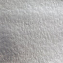 A close-up texture shot of a light gray, slightly mottled fabric or material surface.