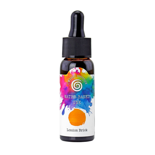 A small amber glass dropper bottle of Cerak Shimmer Water-Based Ink in the color 'London Brick', featuring a colorful paint-splatter label with an orange color swatch and a black dropper cap.