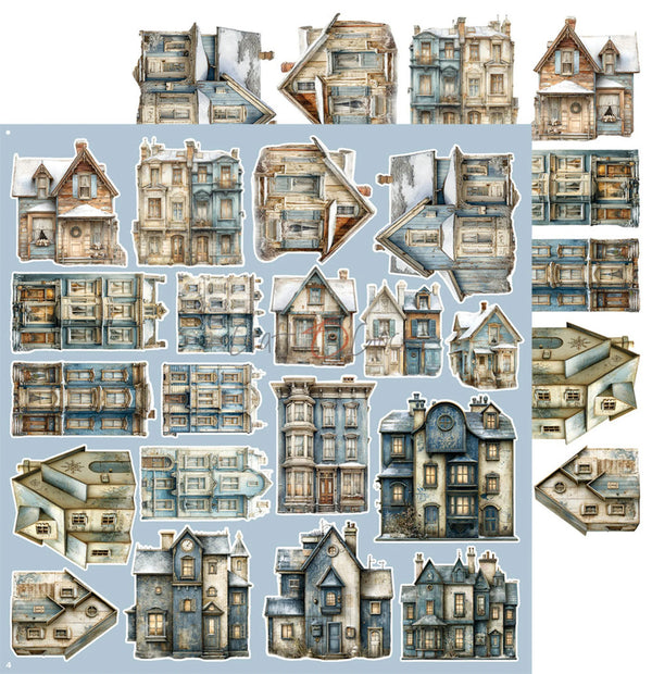 A sheet of vintage-style illustrated house cutouts or craft pieces arranged on a light blue background. The pieces depict old Victorian and Georgian houses with weathered beige, gray, and blue tones, shown both upright and mirrored.