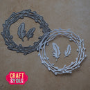 Metal cutting dies with feather and wreath design on a brown background, branded 'Craft & You'.