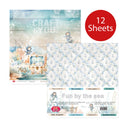 A craft paper set package labeled 'Fun by the sea' with a red circle reading '12 Sheets.' The package shows two sample paper designs: one with a pastel underwater scene and one with a repeating light blue anchor pattern on white.