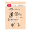 A sheet of clear stamps from Craft & Your Design featuring Christmas-themed designs including musical notes, a Santa portrait, a compass, a postmark, snowflakes, and pine branches on a peach background.
