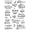 A sheet of clear acrylic or rubber stamp stamps with various black printed phrases and small floral/leaf illustrations, arranged on a plain white background.