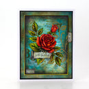 A square handmade greeting card featuring a distressed teal and gold background with two red roses, green leaves, and a banner reading 'With Gratitude'. The card is presented on a clean white background with a subtle reflection.