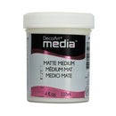 A white plastic jar of DecoArt Media Matte Medium with a white screw cap and a black, white, and pink label.