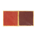 Two squares, one red and one dark brown, in a clear plastic sleeve with a gold-toned border, shown against a plain white background.