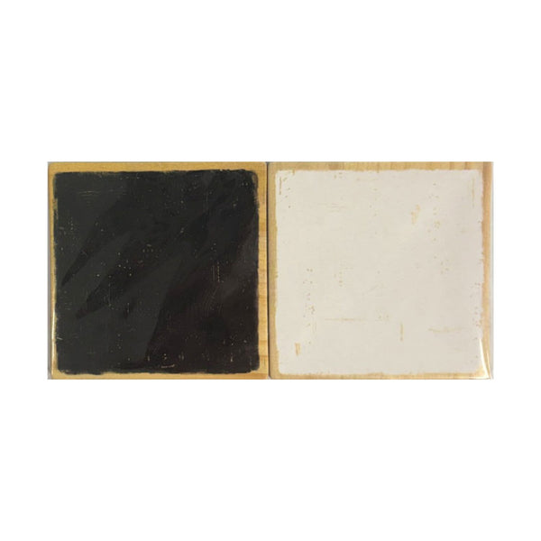 A square decorative tile or coaster with a split design, featuring a glossy black textured panel on the left and a matte off-white panel on the right, bordered by a thin gold-toned edge, shown against a plain white background.