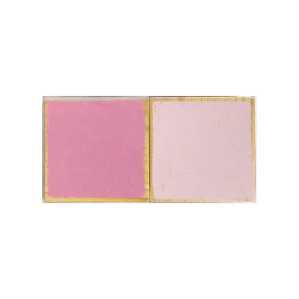 Four square chipboard,  pink and pale pink, set in a clear rectangular case with gold-toned edges, shown on a plain white background.
