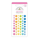 A package of Doublebug Design Co. 'sprinkles' birthday girl assortment stickers, featuring rows of colorful bubble stickers in pink, orange, yellow, green, and blue on a white backing card with a pink header.