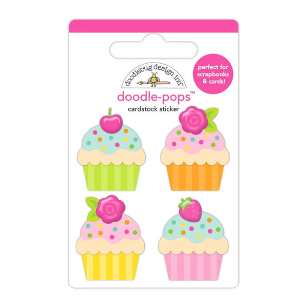 A package of four 'doodle-pops' cardstock stickers by Melting Design Co., featuring colorful illustrated cupcakes with flowers and berries on a white backing card with a pink header.