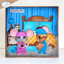 A square handmade greeting card featuring a whimsical mouse family in pajamas in front of a bed. The card has a blue striped background, a wooden headboard, and a gray base.