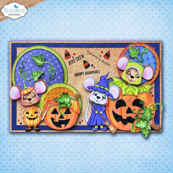 A rectangular Halloween-themed craft card or scrapbook design featuring cartoon mice in pumpkin and witch costumes, two jack-o'-lanterns, circular decorative elements, and the text 'BOO CREW' and 'Happy Haunting!'. The design is shown on a light blue patterned background with an 'Elizabeth craft designs' logo in the top-left corner.