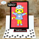 A handmade 3D pop-up greeting card for pets, featuring a yellow cartoon cat wearing a blue cap and jacket on a red gingham background. The card is shown open, revealing a white bottom panel with black paw prints and a message that reads 'You make all 9 lives worth living!'.