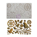 A silicone mold tray shown above its corresponding metal casting pieces, featuring bird, snowflake, gear, and branch motifs in a vintage engraving style.
