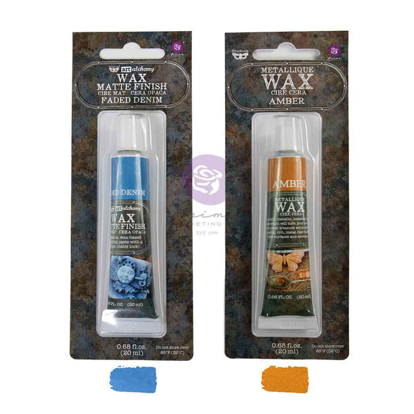 Two tubes of Dicotomy brand Metallic Wax Gel Wax in a matte finish and amber tinted finish, packaged in clear plastic blister packs with a textured dark background. Blue and orange color swatches are shown below the packages.