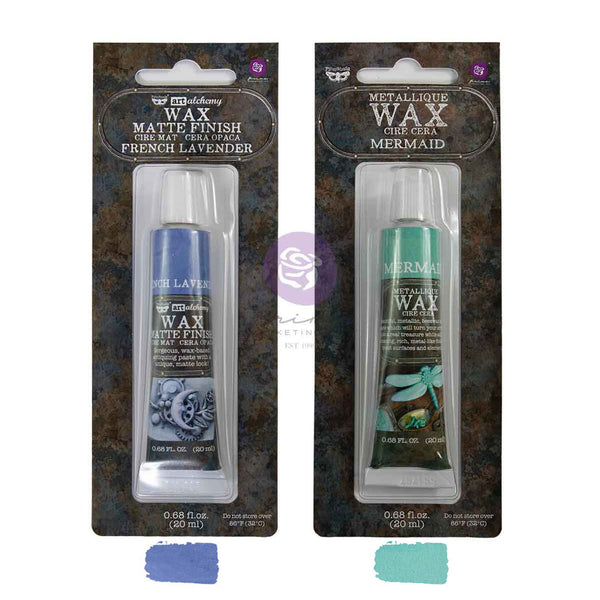 Two tubes of Melodynomy Metallic Wax Matte Finish craft wax in French Lavender and Mermaid Sea Green, shown in their retail packaging with color swatches below.
