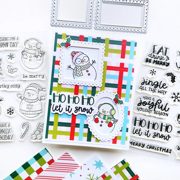 A festive handmade holiday card featuring a snowman illustration and the phrase 'HO HO HO let it snow,' displayed alongside matching clear stamps and decorative paper pieces on a white background.