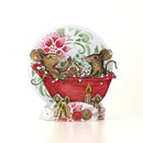 A 3D pop-up greeting card featuring two brown mice in a red bathtub filled with Christmas ornaments, set against a floral background with candles and ornaments at the base.