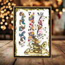 A square handmade card featuring a whimsical sock-themed illustration with a mouse, scissors, and patterned socks, displayed on a wooden surface with warm bokeh lights in the background.