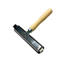 Metal tool with wooden handle on a white background