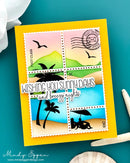 Card with postage stamp designs and text 'Wishing you sunny days and breezy nights' on a teal background.