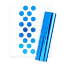 Blue circular stickers on a white sheet next to a roll of shiny metallic blue stickers, photographed on a white background.