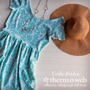 Turquoise dress with white pattern, necklace, and brown hat on a white surface with 'Carla Henton Therm o Web' branding.