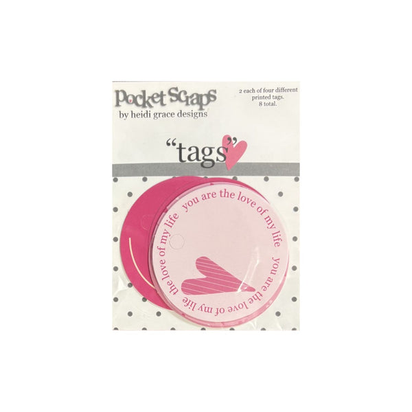 Pack of 'tags' by Heidi Grace Designs, featuring pink and white circular paper tags with hearts and romantic phrases, in its original retail packaging.