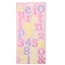 A sheet of decorative alphabet and number stickers on a light pink backing card, featuring pastel yellow, lavender, and pink letters and numerals.