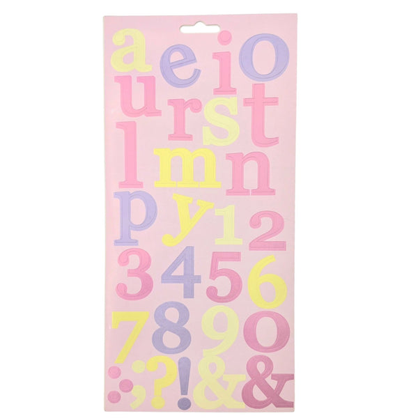 A sheet of decorative alphabet and number stickers on a light pink backing card, featuring pastel yellow, lavender, and pink letters and numerals.