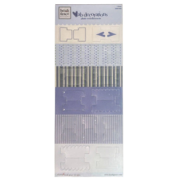 Heidi Grace-  die-cut tabs in a tall packaging card, featuring various light blue, lavender, and white patterned sheets.