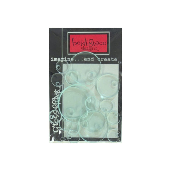 Heidi Grace Designs, featuring circular acrylic discs on a black backing card with a red brand label.