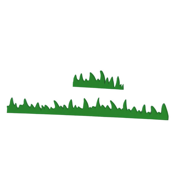 Two green grass-shaped decals or stickers shown on a plain white background, one long strip and one smaller isolated piece.