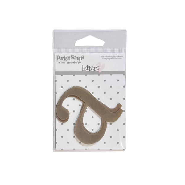 A single collectible paper letter 'a' from the Pocket Scrap by Heart Paper Collection, displayed in its original clear plastic packaging with a white and gray polka dot backing card.