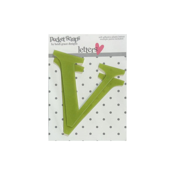A packaged letter 'V' plastic craft cutout from Pocket Scaps by Heidi Grace Designs, shown on a white background with a polka dot pattern.