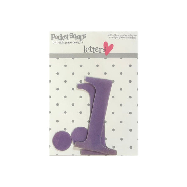 Purple lower case letter 'i' and matching dot embellishments in a clear plastic bag with a white header card labeled 'Pocket Scrap' by Beth Grace Designs.