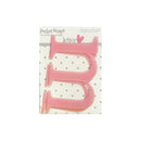 A pink plastic letter 'M' monogramming tool by Pocket Scans, shown on its white retail backing card with a polka dot pattern.