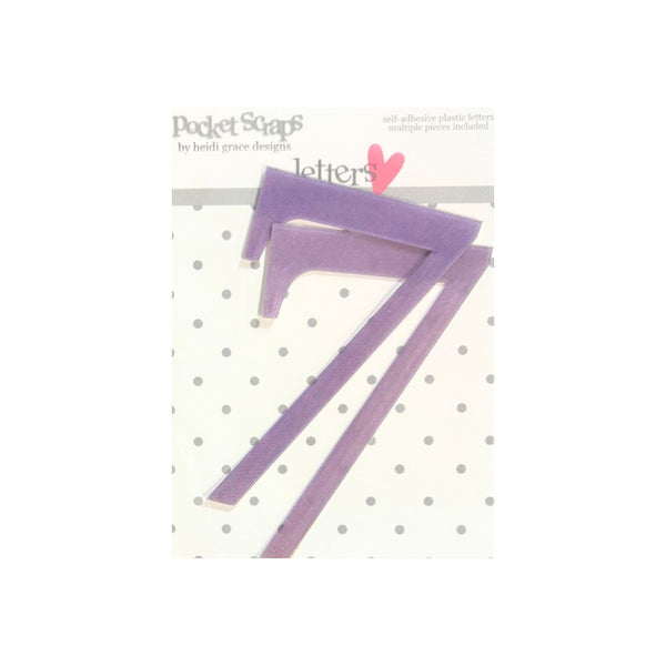 Purple plastic number 'Seven' adhesive pocket clips by Heidi Grace Design, shown on their original white card packaging with a polka dot pattern.