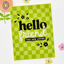 Green checkered card with 'hello friend you are loved' text on a white background with floral decorations.