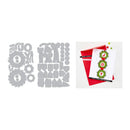 A flat lay showing a gray metal die-cutting or stamping template sheet with multiple holiday-themed shapes on the left, and a finished greeting card example on the right. The card features a white background, a red envelope, and green and red garland designs spelling 'JOY'.