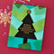 Geometric Christmas card with a tree design and text on a red background