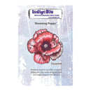 A product card for the IndigeBlu 'Blooming Poppy' rubber stamp, featuring a detailed illustration of a pink and red poppy flower on a textured light blue-gray background with white text and branding.