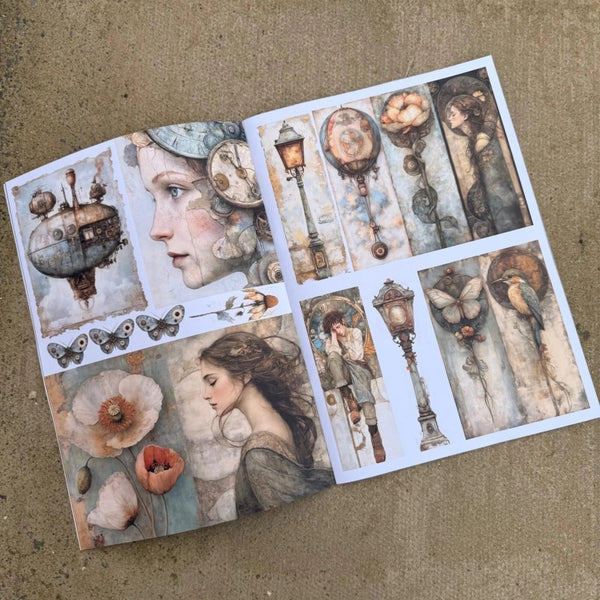 An open art print or sticker album spread on a textured beige surface, featuring vintage-style illustrations including a woman's profile, flowers, butterflies, street lamps, and birds in muted pastel tones.