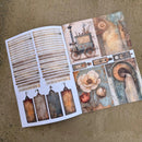 Open book with decorative pages featuring vintage-style illustrations on a textured surface.