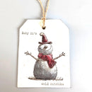 A white gift tag with a rustic twine loop, featuring a hand-drawn style snowman wearing a red hat and scarf, with the text 'Baby it's' above and 'cold outside.' below.