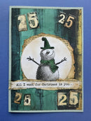 Christmas card with a snowman and text on a blue background