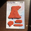 IndigoBlu rubber stamps on a packaging card with branding and product details.